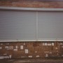 Extruded Continental shutters painted Grey